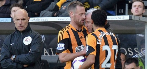 Pardew drops the nut as Howard Webb looks on