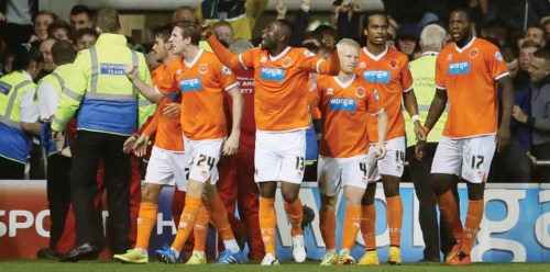 The Mighty Tangerines celebrate one of their three throw-ins this season